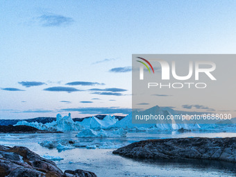 Icebergs near Ilulissat, Greenland. Climate change is having a profound effect in Greenland with glaciers and the Greenland ice cap retreati...