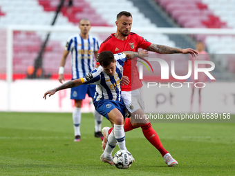 Otavio of FC Porto (L) vies with Haris Seferovic of SL Benfica during the Portuguese League football match between SL Benfica and FC Porto a...