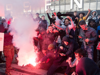 LONDON, UNITED KINGDOM - MAY 06, 2021: Arsenal fans set off a flare as they gather outside the Emirates Stadium ahead of the Europa League s...
