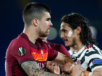Edinson Cavani of Manchester United argues with Gianluca Mancini of AS Roma during the UEFA Europa League Semi-Final match between AS Roma a...