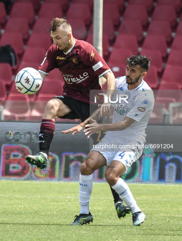 Giovanni Crociata of Empoli FC and Norbert Gyomber of US Salernitana 1919 compete for the ball during the Serie B match between US Salernita...