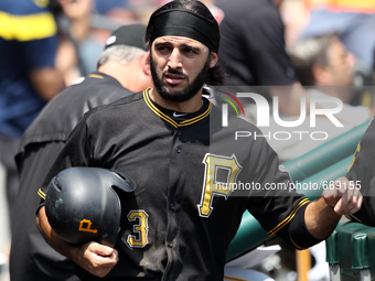 Pittsburgh Pirates' Sean Rodriguez in the dugout after scoring a run in the fifth inning of a baseball game against the Detroit Tigers in De...