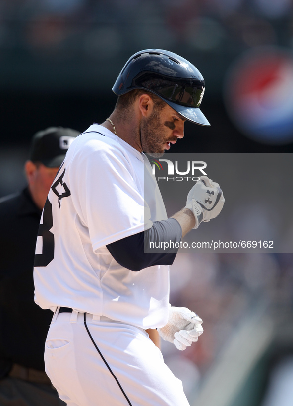 Detroit Tigers' J.D. Martinez rounds the bases after his three-run home run in the eighth inning of a baseball game against the Pittsburgh P...