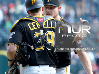 Pittsburgh Pirates catcher Francisco Cervelli and relief pitcher Mark Melancon celebrate the 8-4 victory over the Detroit Tigers in Detroit,...