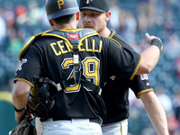 Pittsburgh Pirates catcher Francisco Cervelli and relief pitcher Mark Melancon celebrate the 8-4 victory over the Detroit Tigers in Detroit,...