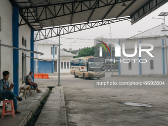 Passengers waiting for departure at Bawen bus station, Semarang Regency, Indonesia on May 8, 2021. This bus station has become quiet as Indo...