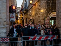 Curious people in front of the barrier before the show on the occasion of the Feast of San Nicola in front of the Basilica of San Nicola in...