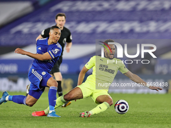 Joelinton of Newcastle United goes down under a challenge from Youri Tielemans of Leicester City during the Premier League match between Lei...