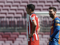 Luis Suarez of Atletico Madrid and Lionel Messi of Barcelona  wlaks prior to the La Liga Santander match between FC Barcelona and Atletico d...
