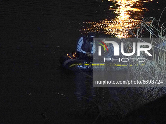 MIgrants in a raft are seen near the Ciudad Miguel Alemán International Bridge on May 7 2021 in Roma Texas US. According to unofficial estim...