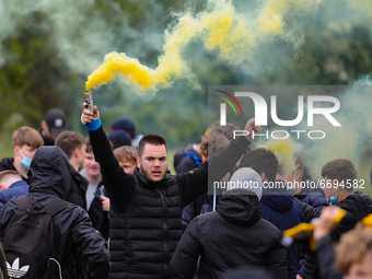 Cambridge United fans celebrating their promotion to league One outside the R Costings Abbey Stadium, Cambridge on Saturday 8th May 2021.  (