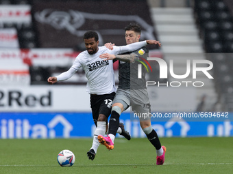 Nathan Byrne of Derby County is bowled over by Josh Windass of Sheffield Wednesdayduring the Sky Bet Championship match between Derby County...