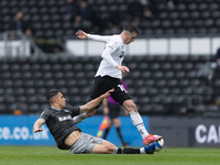 Tom Lawrence of Derby County is tackled by Joey Pelupessy of Sheffield Wednesdayduring the Sky Bet Championship match between Derby County a...