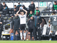 Craig Forsyth of Derby County throws next to Darren Moore, Sheffield Wednesday manager,during the Sky Bet Championship match between Derby C...