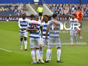 Charlie Austin of QPR celebrates after scoring his team's first goal with his team mates during the Sky Bet Championship match between Queen...