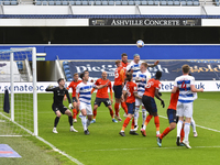  Lyndon Dykes of QPR contests a header with James Bree of Luton town during the Sky Bet Championship match between Queens Park Rangers and L...