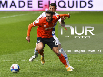 Harry Cornick of Luton town battles for possession with Yoann Barbet of QPR during the Sky Bet Championship match between Queens Park Ranger...