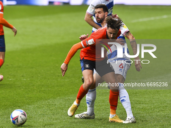 Harry Cornick of Luton town battles for possession with Yoann Barbet of QPR during the Sky Bet Championship match between Queens Park Ranger...