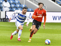 Ilias Chair of QPR battles for possession with Harry Cornick of Luton town during the Sky Bet Championship match between Queens Park Rangers...