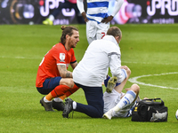 Lyndon Dykes of QPR receives treatment during the Sky Bet Championship match between Queens Park Rangers and Luton Town at Loftus Road Stadi...