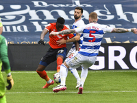  James Collins of Luton town battles for possession with Yoann Barbet of QPR and Jordy de Wijs of QPR during the Sky Bet Championship match...