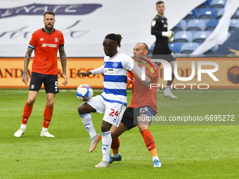 Osman Kakay of QPR battles for possession with Kal Naismith of Luton town during the Sky Bet Championship match between Queens Park Rangers...