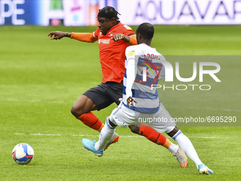 Pelly Ruddock of Luton town battles for possession with Albert Adomah of QPR during the Sky Bet Championship match between Queens Park Range...