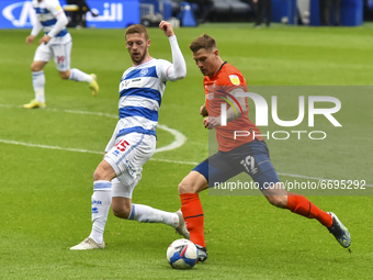 James Collins of Luton town battles for possession with Sam Field of QPR during the Sky Bet Championship match between Queens Park Rangers a...