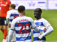 Geoff Cameron of QPR congratulate Albert Adomah of QPR after the Sky Bet Championship match between Queens Park Rangers and Luton Town at Lo...