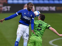 Oldham Athletic's Dylan Bahamboula tussles with Chris Stokes of Forest Green Rovers during the Sky Bet League 2 match between Oldham Athleti...