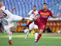 Lorenzo Pellegrini of AS Roma and Ahmad Benali of FC Crotone compete for the ball during the Serie A match between AS Roma and FC Crotone at...