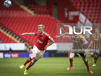   Jaydn Stockley of Charlton Athletic is watched by Callum Elder of Hull City for the ball during the Sky Bet League 1 match between Charlto...
