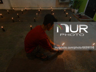 Gorontalo ethnic Muslims carry out the Tumbilotohe tradition or night lights on in their yard in Palu, Central Sulawesi Province, Indonesia,...