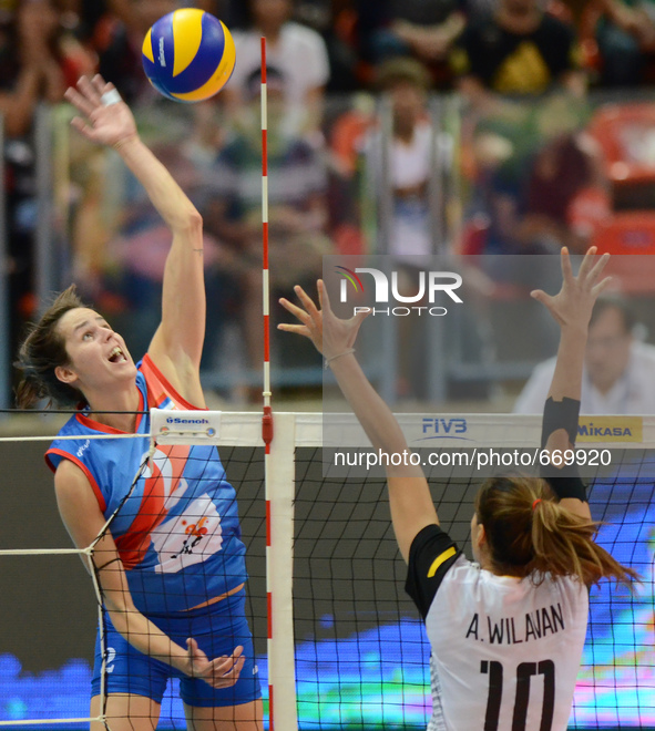 Drpa Marta (L) of Serbia spikes the ball during the FIVB World Grand Prix intercontinental round match against Thailand at Indoor Stadium Hu...