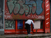 A man cleans the facade of a local barbershop in Dublin's Portobello area before it reopens, scheduled for tomorrow 10 May.
On Sunday, 9 May...