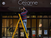 A man paints the facade of a local Hair and Beauty Salon in Dublin city center before it reopens, scheduled for tomorrow 10 May.
On Sunday,...