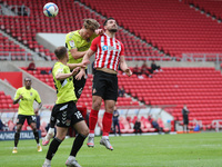   Bailey Wright of Sunderland contests a header with Northampton Town's Fraser Horsfall during the Sky Bet League 1 match between Sunderland...