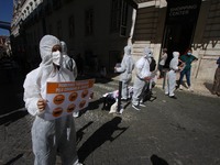 Members of the Animal Save group, wearing protective suits and carrying banners, hold a rally to raise awareness about the relationship betw...