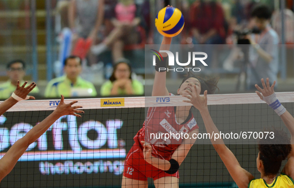Yuki Ishii of Japan spikes the ball during the FIVB World Grand Prix intercontinental round match against Brazil at Indoor Stadium Huamark i...