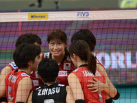 Japan players celebrate after winning a point during the FIVB World Grand Prix intercontinental round match against Brazil at Indoor Stadium...