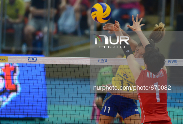 Joyce Silva (#11) of Brazil spikes the ball during the FIVB World Grand Prix intercontinental round match against Japanl at Indoor Stadium H...