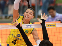 Ana Carolina Da Silva (L) of Brazil spikes the ball during the FIVB World Grand Prix intercontinental round match against Japanl at Indoor S...