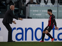 Milan midfielder Brahim Diaz (21) celebrates with Milan coach Stefano Pioli after scoring his goal to make it 0-1 during the Serie A footbal...