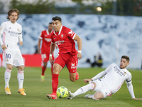 Marcos Acuna of Sevilla CF in action with Federico Valverde of Real Madrid during the Spanish Liga Santander match between Real Madrid and S...