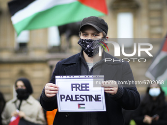 Pro-Palestine demonstrators hold a solidarity demonstration against Israeli actions in Jerusalem's Sheikh Jarrah neighbourhood and around th...