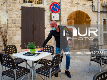 The waiter of a pub cleans the tables on the first day of reopening in the yellow zone in Molfetta on 10 May 2021.
After fifty days, Puglia...
