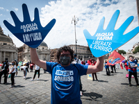  Managers, owners and workers in the theme park sector protest in Piazza del Popolo, Rome,, Italy on May 11, 2021 to demand a rapid opening,...