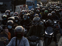 Motorcyclist pile up as police banned border area at Bekasi, West Java, Indonesia, on 11 May 2021 to prevent them returning home to prevent...
