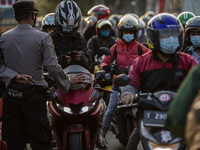 Motorcyclist pile up as police banned border area at Bekasi, West Java, Indonesia, on 11 May 2021 to prevent them returning home to prevent...