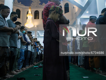 Acehnese muslims perform the last tarawih prayer on the holy month of Ramadan at the Jamik Mosque in Lhokseumawe, on May 11, 2021, Aceh Prov...